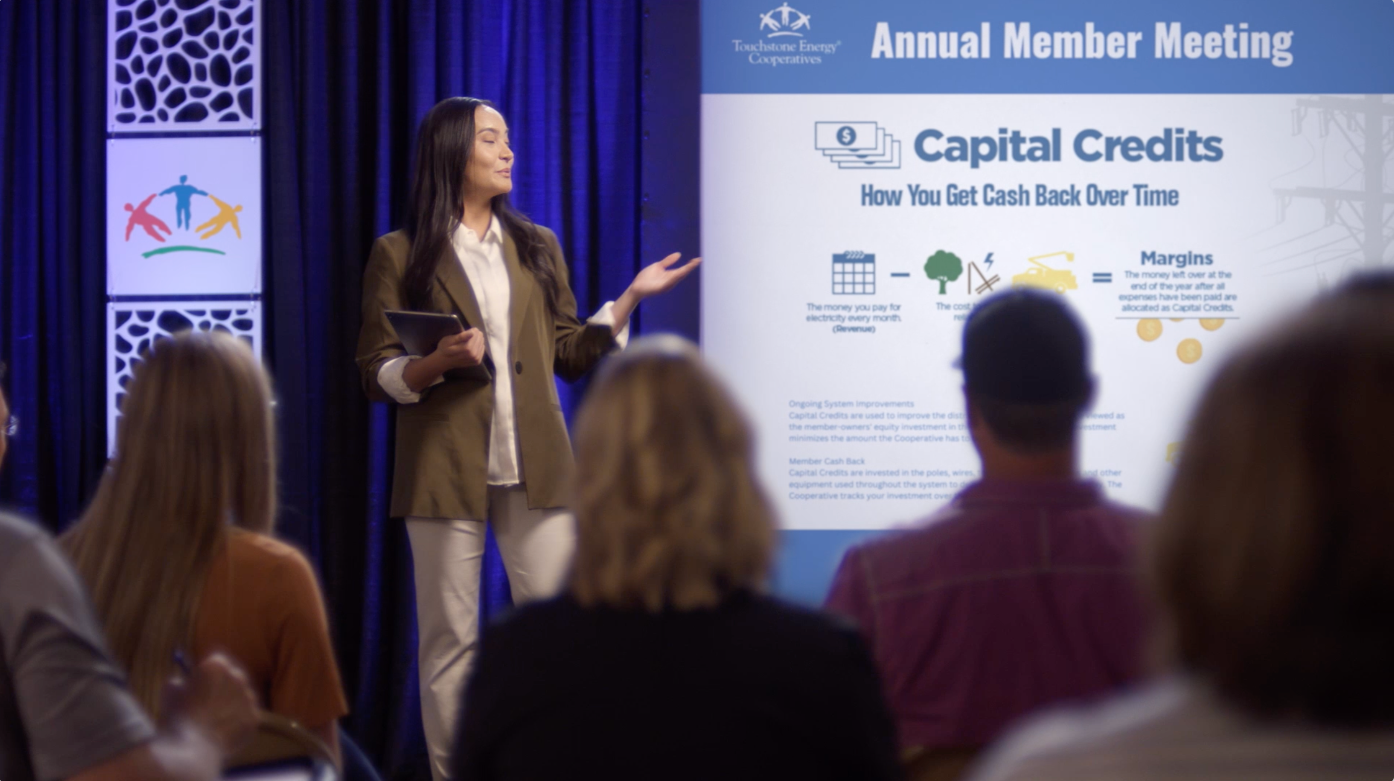 Women Giving Presentation about Capital Credits
