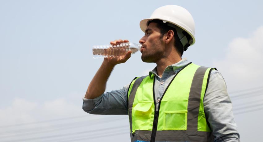 worker drinking water bottle