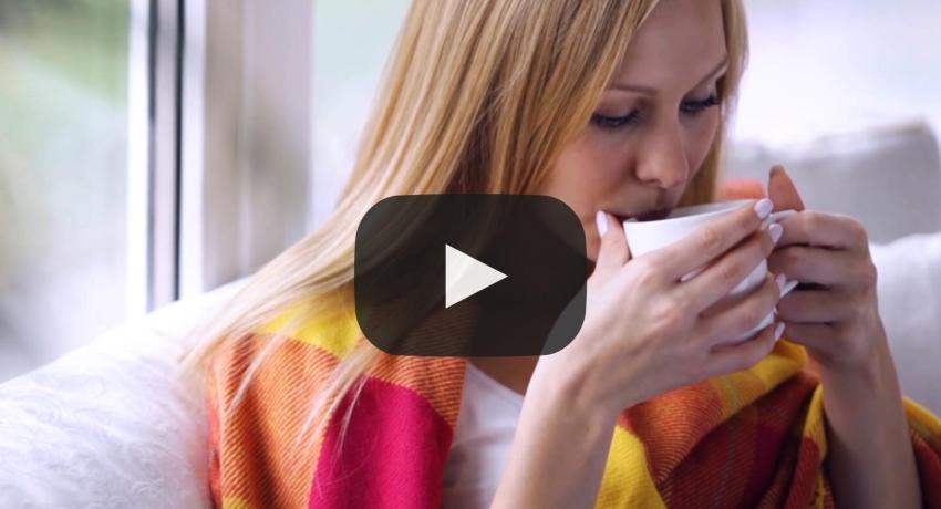 video thumbnail of lady sipping coffee on couch