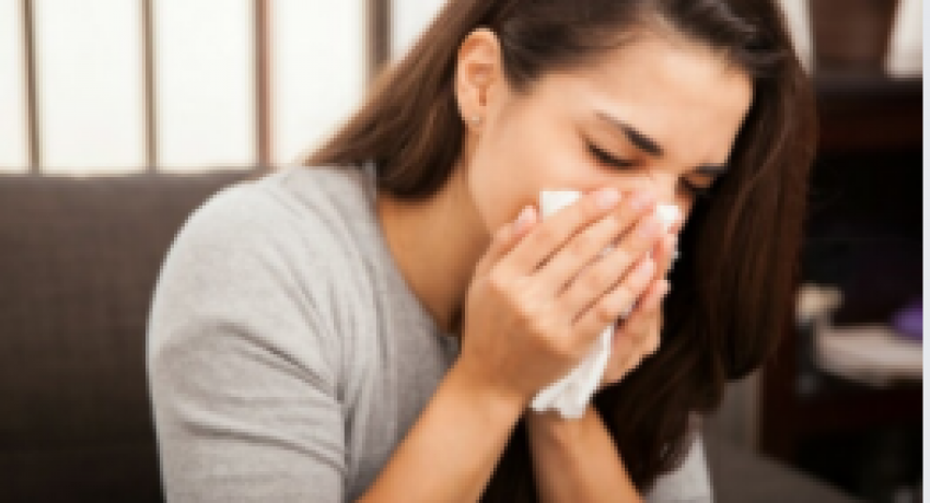 Photo showing woman blowing her nose