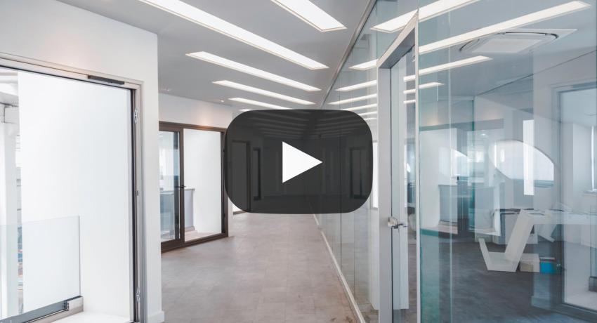 Image of office hallway, with office rooms to the left and right