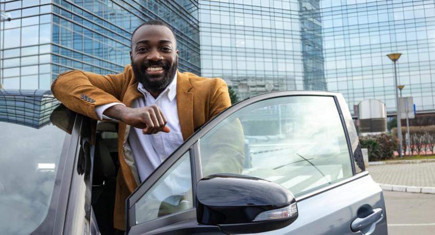 guy standing by his EV