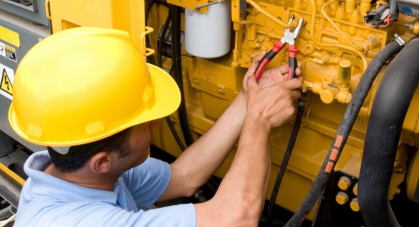 Man fixing generator