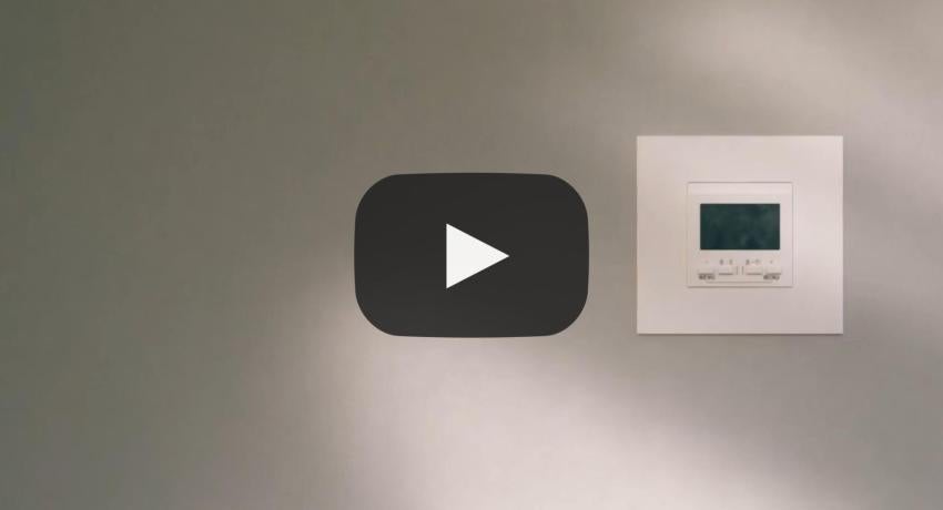 Still of a video showing thermostat in wall