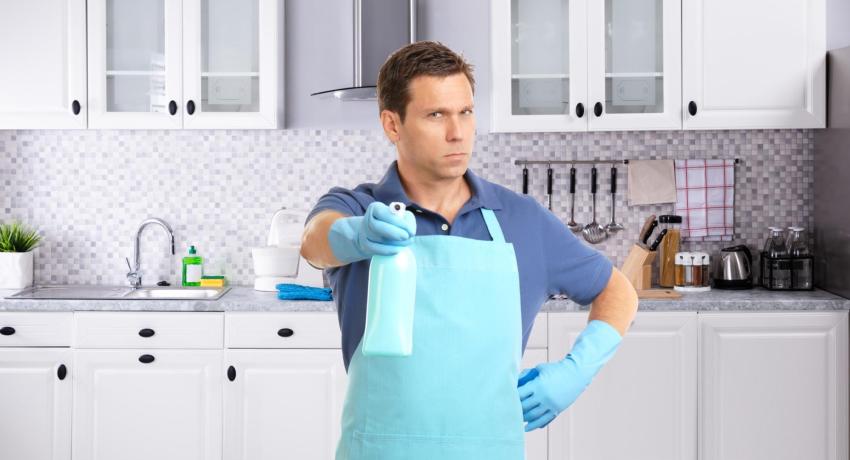 Man in apron looking into camera