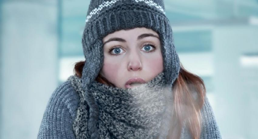 Woman shivering in the cold