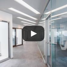 Image of office hallway, with office rooms to the left and right
