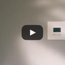 Still of a video showing thermostat in wall