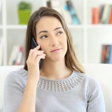 lady on phone talking to scammer