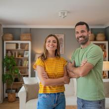 Smiling couple in living room