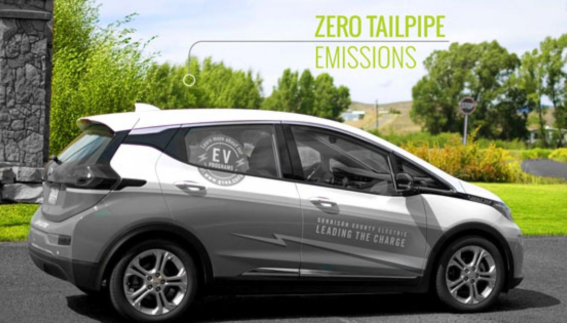 EV driving with text saying "Zero Tailpipe Emissions" 